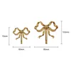 Ganci Rails Golden Bowknot Rame Bagno Appendiabiti Portasciugamani Soggiorno Sfondo Display Decorazione domestica moderna 230327