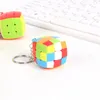 Mini Cube KeyChain Magic Cubes Three-Stage Rubik's Cube KeyChain Puzzle Mofangge för nybörjare Professional Cubo Magico Toys for Children Barn storleken är 3x3x3