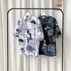 Camisas casuales para hombres Camisa de playa hawaiana con estampado de periódicos para hombres 2020 Verano de manga corta 3XL Camisas de aloha para hombres Ropa de vacaciones para vacaciones Chemise W0328