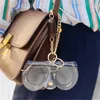 Étuis à lunettes de soleil Sacs 2022 Étui à lunettes laser en PVC avec chaîne en métal Ins Populaire Mignon Transparent Femmes Lunettes de soleil Couverture de protection Lunettes de soleil Sacs J230328