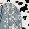 Женские блузки летняя цветочная рубашка модная отпечатка. Случайные женщины мужская уличная одежда корейская шлифовальная гавайская гавайская шерсть 2023