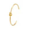 Bracciale rigido 2023 design color oro metallo placcato rame nodo intrecciato braccialetto per le donne regalo di gioielli per vacanze di nozze