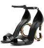 Elegante Luxurys Marken Keira Frauen Sandalen Schuhe polierte Kalbsleder Baroquel Heels Pop Heel Gold-plattierte Kohlenstoff Dame Sommer Mode Kleiderparty Gladiator Sandalias