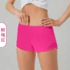 L-091 Short taille basse chaud Short de yoga respirant à séchage rapide Short de sport doublé intégré Poches latérales à fermeture éclair dissimulée Pantalon de survêtement de course avec cordon de serrage continu