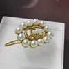 2023 Designer neue Gujia Doppel G Perle Halskette Armband Ohrringe Haarspange Brosche Messing Material Licht Luxus elegante Temperament Kette Set Frauen