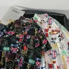 Męskie zwykłe koszule Harajuku ciemna ikona drukowana koszula na Hawajskie Mężczyźni Summer Men Shirt Shirt Shileve Streetwear Odzież Hawaje Button Lapel krótkie rękawy W0328