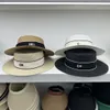 Szerokie brzegowe kapelusze słomkowe luksus C list czarny kapelusz łuk letnia wycieczka przeciwsłoneczna sunshade europejska i amerykańska retro rekrea