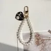Porte-clés en chaîne de perles pour filles et femmes, 4 styles, pendentif de sac à main, décoration, accessoires de mode, vente en gros