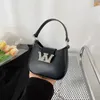 Designer kvinnors väska liten doftkedja bärbar ny senior textur mini en-axel tvärkropp små ryggsäckväskor