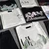 amirrs Édition Limitée Designer T-shirt Nouvelle Lettre Classique Année du Lapin Couples Tees Street Wear Chemise De Mode D'été Splash-ink Lettre Imprimer S-5XL 783432738