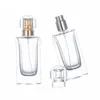 Bouteille en verre de parfum carré clair 30 ml 50 ml emballage or argent pompe de presse spary avec couvercle conteneur portable emballage rechargeable cosmétique