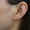 Boucles d'oreilles délicates en argent sterling 925, mini breloque en forme d'étoile à géométrie mignonne avec pavé de CZ clair, bijoux de fête à la mode pour femmes