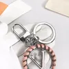 Keychain Brand Flower Designer Mens Luxury Car Keyring Womens V Letter Pink Leather Knitting Keychains Fashion Keychain Bags Pendant No Box