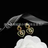 Designer di charm Orecchini a lettera doppia G Dropped Orecchini con nappe adesive Love 925 Materiale in ottone con ago in argento