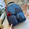 Mochilas MULTIPOCKET Deisgner 23ss Mens Womens Graffiti Mochilas Flower Nigo Ink Watercolor Leather Blue Sky Cloud Bag Double Shoulder Laptop Bags M57841 M20910