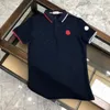 2023 Marque de luxe Polo de créateur pour hommes T-shirt d'été à la mode respirant à manches courtes revers haut décontracté Polo Simple