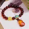 Strand Fine Blood Natural Crystal Armband Runda pärlor med Cheongsam Pendant Handsträng Lycklig skönhet för kvinnors gåva smycken
