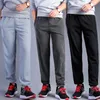 Pantaloni da uomo Taglie forti Sport grassi Larghi lunghi dritti Legati alla caviglia Primavera ed estate Fitness da corsa all'aperto