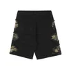 Shorts masculinos verão camou jeans shorts masculinos de hip hop destruído camuflagem americana moda vintage tassel retchwork jeans shorts t230502