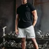 Мужские шорты Новая мускульная фитнес -брат спортивные шорты Мужские летние свободы.