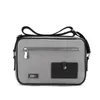 Factory direct men's one-shoulder cross-body briefcase outside a decorative camera bag