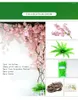 Dekorative Blumen, künstlicher Kirschbaum, Sakura-Stamm mit Blütenblumen, getrockneten Zweigen, Rattan-Sets für die Wanddekoration zu Hause