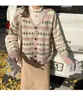 Damesbreien T-stukken 2023 Leer- en herfststijl Retro Koreaans losse kant V-hals schattige leeftijdsverlaging met lange mouwen trui gebreide jas Vrouwen
