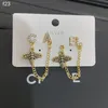 Дизайнерские женщины болтают серьги из шарма 18 тыс. Золотых цепочек Серьги для модных ювелирных ювелирных ювелирных изделий Семейство Love Gif