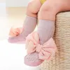 First Walkers Born Baby Girl Sock Scarpe carine Bowknot Soft Sole Slifori a pavimento non slip che camminano per un bambino bambino