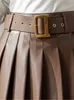 Jupes Seoulish vert Faux cuir PU plissé jupes pour femmes avec ceinture taille haute Sexy Mini jupes femme automne hiver 230504