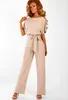 Kobiety Jumpsuits Rompers Kobiet kombinezonu Elegancki krótki rękaw wydrążony talia Solidne letnie spodnie na nogi Bodysuit Bodysuit Great Noge Spodnie 230503