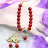 Collana di orecchini set squisito corallo artificiale rosso 8 mm perline rotonde braccialetto per le donne gioielli unici fai da te cloisonne 7,5 pollici B3030