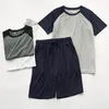 Mäns sömnkläder Modala sommarpyjamas för män tunn sektion Löst korta ärmshorts kan bäras utanför sportens hemtjänst kostym män sömnkläder 230503