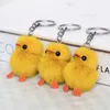 10pcs/lote-5cm Real genuíno pato pato pato pompom saco saco de charme de keyring pingente de keyring presente