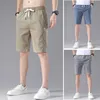 Heren shorts 4 kleuren klassieke stijl heren slanke shorts 2023 zomer nieuwe zakelijke mode dunne rek kort casual broek mannelijk beige kaki grijs p230505