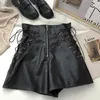 Pantalones cortos para mujer Nuevo diseño coreano Cremallera Cordón Cintura alta Pu Pantalones cortos de cuero Negro Blanco Marrón Z0505