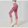 Leggings pour femmes Couleur unie Hip Lift Pantalon de yoga Femme Mesh Pocket Taille haute Pantalon à sept points Bottoming Pants Sports and Fitness Leggings 230505