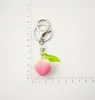 Keychains schattige 3D Peach Summer Fruit Metal Keychain voor vrouwelijke Key Chains Ring Car Bag Handhals Charm Airpods Accessoires X72