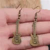 Boucles d'oreilles pendantes accessoires de mode européens et américains rétro Simple haute qualité Rock guitare pendentif fille