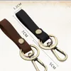 Chaveiros 1pcs destacáveis ​​corrente de corrente de correia de couro anel Keyfob keyring qdd9252