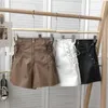 Pantalones cortos para mujer Nuevo diseño coreano Cremallera Cordón Cintura alta Pu Pantalones cortos de cuero Negro Blanco Marrón Z0505