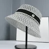 Chapeau de seau de seau de paille de paille creux de paille en été femme chapeau de seau de seau de style coréen de style coréen