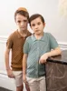 家族を一致する衣装の兄弟姉妹競技服の夏の男の子と女の子編み衣料ティーンエイジャーシャツカーディガンティーンエイジャーベビーショーツ230505