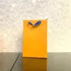 Saco de luxo de alta qualidade, saco de papel portátil amarelo, saco de papel para armazenamento de roupas