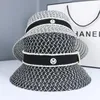 Chapeau de seau de seau de paille de paille creux de paille en été femme chapeau de seau de seau de style coréen de style coréen