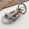 Obiekty dekoracyjne figurki rękodzieło klęcznikowe retro stal nierdzewna stal nierdzewna Budda Buddha Keyring Kreatywne mężczyźni kobiety Trunket Dekora