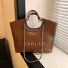 50% de réduction sur l'usine en ligne Nouveau sac pour femme Petit sac à main de style parfumé Cuir ciré Diagonal Straddle Chain Strap Single Shoulder Wind