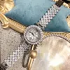 女性の時計エレガントなファッションの女性Sジュエリーラグジュアリーブレスレットウォッチ防水石英ローマのリストウォッチロータス230506