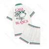 Casablanc-S 22SS 디자이너 셔츠 마사오 산 프린트 남성 캐주얼 셔츠 여성 느슨한 실크 셔츠 짧은 슬리브 고급 티셔츠 고품질 티