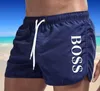 Fast färg sommar snabbtorkande shorts tryckta shorts bad strand shorts avslappnad fitness shorts mäns badkläder sexiga badstammar